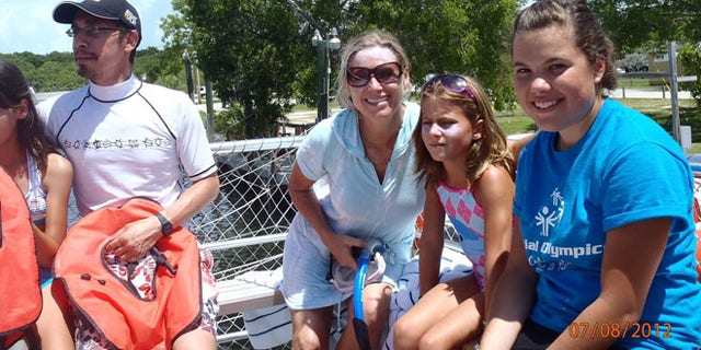 A photo shows the family who presumably lost their camera in Sanibel Island.