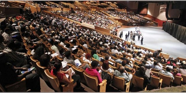 Job candidates wait for their numbers to be called at the Knight Center to enter a U.S. Congressional Black Caucus Jobs Fair in Miami, Florida August 23, 2011.