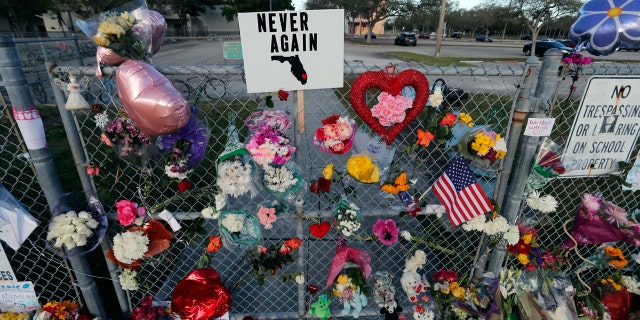 A makeshift memorial is seen outside the Marjory Stoneman Douglas High School, where 17 students and faculty were killed.