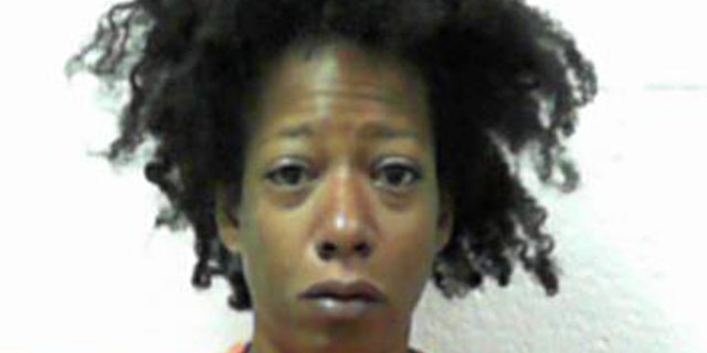 This Aug. 7, 2017 photo made available by the West Virginia Regional Jail & Correctional Facility Authority, shows Erica Newsome under arrest.
