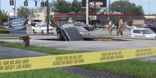 A sinkhole in Marion County swallowed a car, according to the Ocala Fire Department.