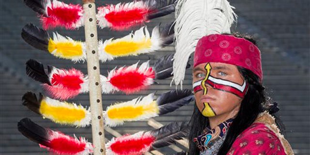 The wearing of a Native American headdress is considered offensive by many schools.