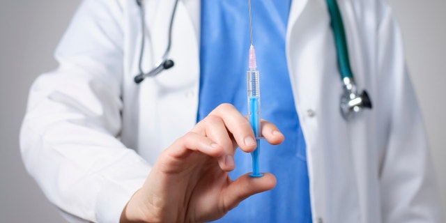 flu shot syringe istock