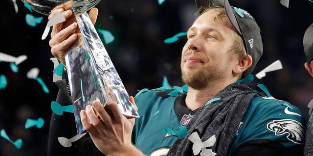 Philadelphia Eagles' Nick Foles holds up the Vince Lombardi Trophy after the NFL Super Bowl 52 football game against the New England Patriots, Sunday, Feb. 4, 2018, in Minneapolis. The Eagles won 41-33. (AP Photo/Matt Slocum)