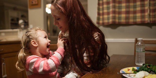 Jan. 25, 2014: Maggie Barcellano with daughter Zoe, 3, at her father's house in Austin, Texas.