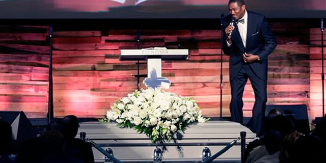 Aug. 15, 2015: Pastor Ronnie Goines gives the eulogy during funeral services for Christian Taylor, 19, at the Koinonia Christian Church in Arlington, Texas. The black college football player was fatally shot by a North Texas police officer answering a burglary call at a car dealership.