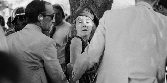 Sept. 5, 1975 file photo shows Secret Service agents put handcuffs on Lynette "Squeaky" Fromme after she pointed at President Gerald Ford, in Sacramento, Calif.