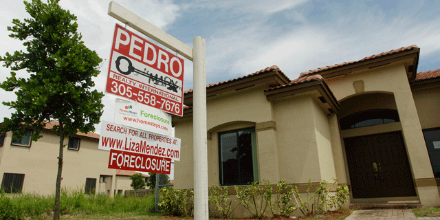 In this Sept. 14, 2010 file photo, a house in Homestead, Fla. sits empty, for sale as a foreclosure home in a neighborhood where half of the houses were empty and up for foreclosure.