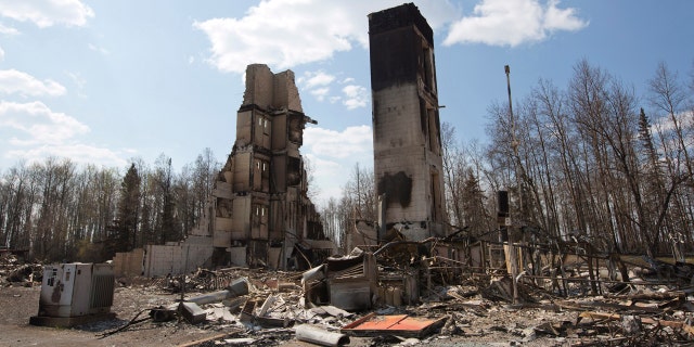 May 13, 2016: A burned building stands among charred rubble in the neighborhood of Abasand in wildfire-ravaged Fort McMurray, Alberta