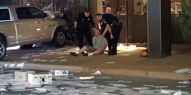 A man was arrested after crashing his truck into the studios for FOX 4 in Dallas early Wednesday.