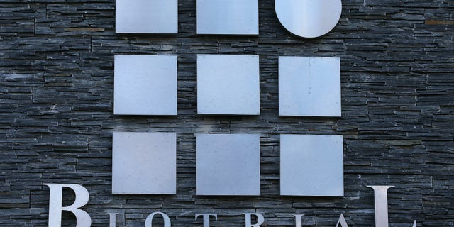 FILE - This Friday, Jan. 15, 2016 file photo shows a logo of the Biotrial laboratory displayed on its building in Rennes, western France. Frances health minister has presented a plan to tighten up the rules regarding human drug trials following an experimental test that killed a volunteer in January. (AP Photo/David Vincent, File)