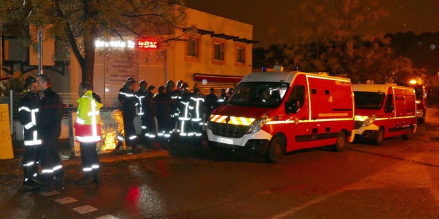 Firefighters and ambulances are seen in the village of Montferrier-sur-Lez, southern France, Friday, Nov. 25, 2016.
