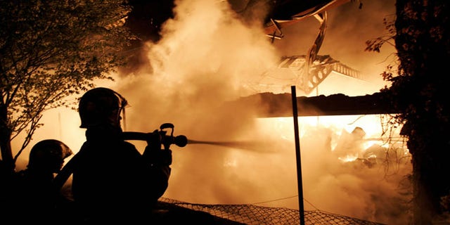 Many of France's "sensitive urban zones," called "no-go" zones by some observers, typically keep to themselves, but are apt to flare up on occasion, experts say. In 2005, the accidental deaths of two teenagers in an impoverished Paris suburb during a police sweep touched off a national wave of unrest, leading to rioting and the torching of schools, community centers and thousands of cars. Here, French firemen confront a blazing warehouse fire near Le Bourget on Nov. 4, 2005.