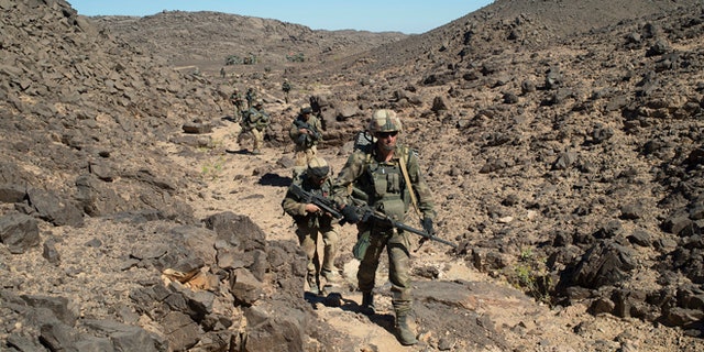 March 8, 2013: In this photo taken by the French Army Communications Audiovisual office (ECPAD) shows French soldiers patrolling in the Mettatai region in northern Mali.