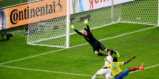 June 25, 2014: Ecuador's Michael Arroyo (15) takes a shot which goes wide past France's goalkeeper Hugo Lloris as France's Laurent Koscielny defends during the group E World Cup soccer match between Ecuador and France at the Maracana Stadium in Rio de Janeiro, Brazil.