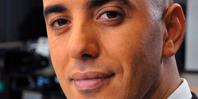 In this photo dated Nov. 22, 2010, notorious French criminal Redoine Faid poses prior to an interview with French all-news TV channel, LCI, as he was promoting his book, in Boulogne-Billancourt, outside Paris, France.