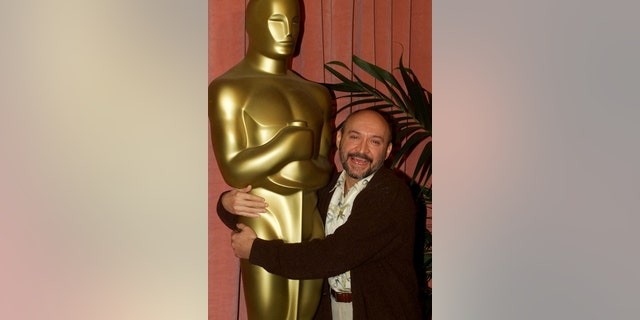 Director Frank Darabont puts his arms around a large Oscar statue as he arrives for the Academy of Motion Picture Arts &amp; Sciences Oscar nominee luncheon, March 13 in Beverly Hills. Darabont is nominated as best director for his film "The Green Mile." The Academy Awards will be presented March 26 in Los Angeles.FSP/HB - RTR27IY