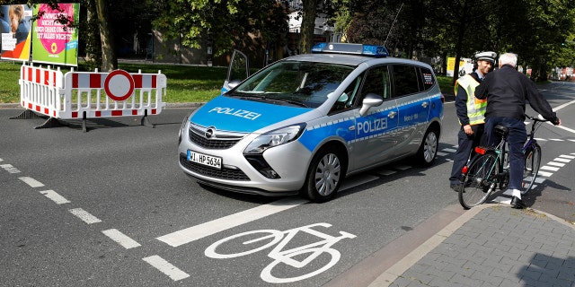 Police officers close a street as 60,000 people in Germany's financial capital are about to evacuate the city while experts defuse an unexploded British World War Two bomb found during renovations on the university's campus in Frankfurt, Germany, September 3, 2017.