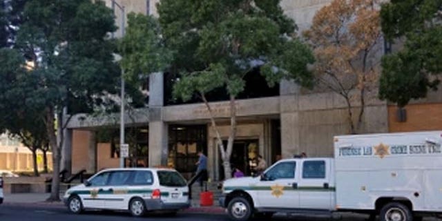 The office was crowded Saturday morning when Vang pulled out a handgun and opened fire, officials said.