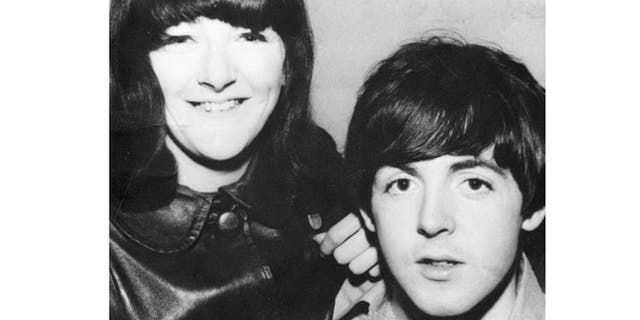 Freda Kelly is seen posing with Paul McCartney.