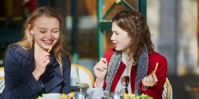 friends eating junk food istock medium