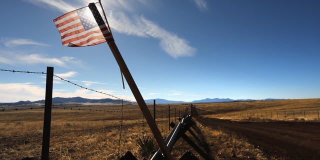 An American flag flies at the U.S.-Mexico border on February 26, 2013 near Sonoita, Arizona.
