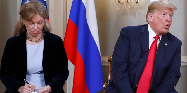 July 16: Interpreter Marina Gross takes notes while President Trump talks to Russian President Vladimir Putin.