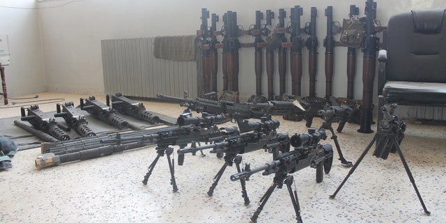 Abu Zayd's weapons arsenal, in which he claims many of the arms were issued through U.S training programs.