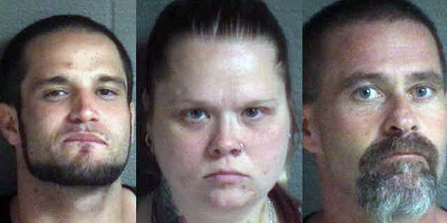 (From left) Larry Hawkins, Jennifer Hawkins and Frederick Badgero were charged Saturday with harboring Stroupe during the search for him.