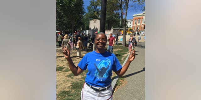 “People are beautiful when they shine with faith,” said this woman who attended with her son.