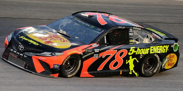 Martin Truex Jr. drives into Turn 1 during the NASCAR Cup Series auto race at Darlington Raceway, Sunday, Sept. 2, 2018, in Darlington, S.C. (AP Photo/Terry Renna)