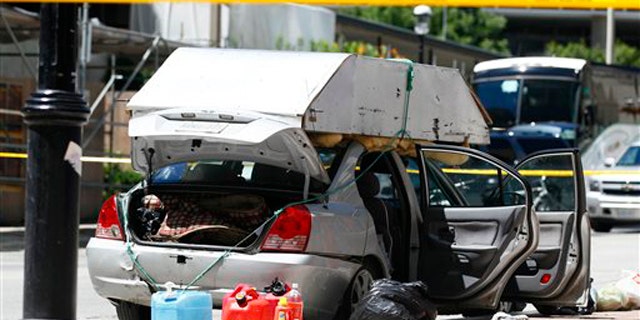 June 24: A car seized by police sits near the intersection of Scott Street and Esplanade in Toronto.