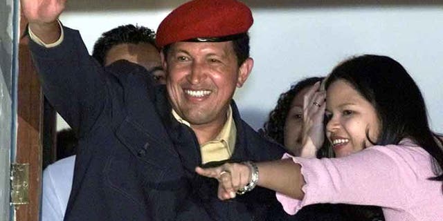 Late President Chavez and his daughter Maria Gabriela in a July 30, 2000 file photo.