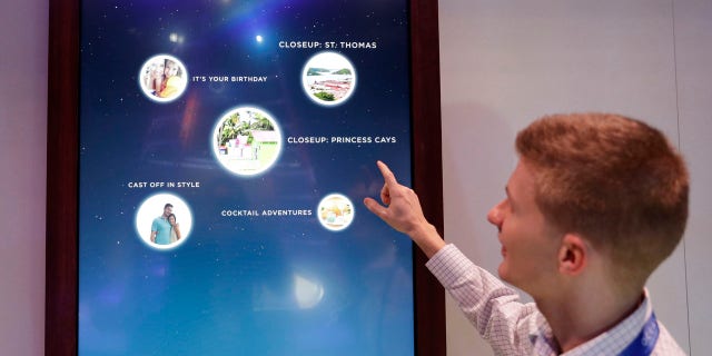 Miles Clark of Carnival Corp. demonstrates the Ocean Compass interface before CES International, Tuesday, Jan. 3, 2017, in Las Vegas.