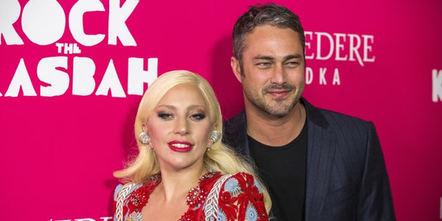 October 19, 2015. Singer Lady Gaga arrives with Taylor Kinney for the premiere of the film "Rock the Kasbah" in New York.
