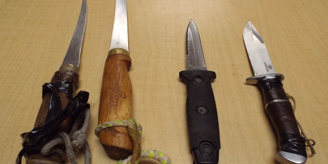 Gaither had at least four knives on him during the incident, in addition to an armor made of porn magazines taped to his torso.