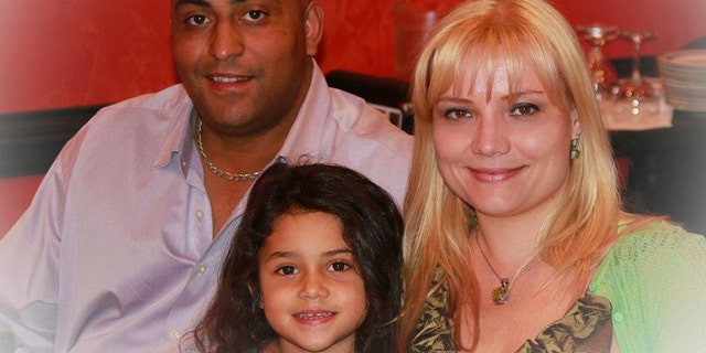 Hamlet Garcia, 42, his wife, Olesia Garica, 34, and their seven year old daughter Fiorella.