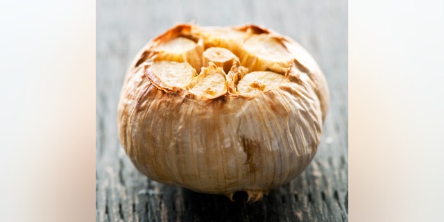 Close up of fresh roasted garlic bulb