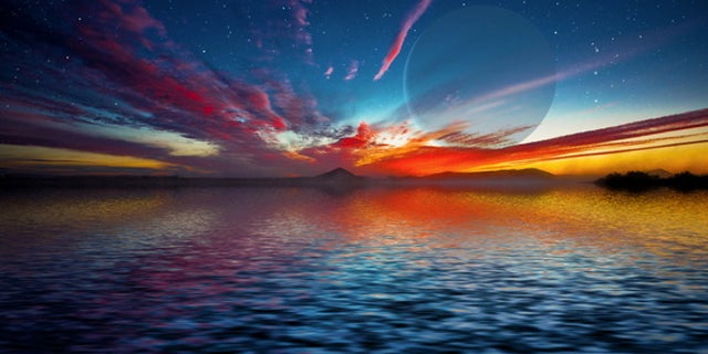 This artist’s depiction shows a gas giant planet rising over the horizon of an alien waterworld. New research shows that oceans on super-Earths, once established, can last for billions of years.