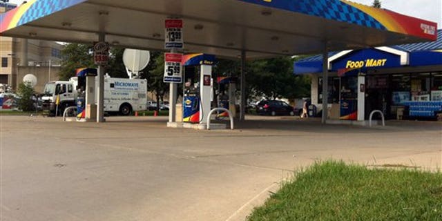 FILE- In this Thursday, Aug. 16, 2012, file photo, gas prices are advertised at a Sunoco gas station and market in Lapeer, Mich. U.S. drivers are paying an average of $3.72 per gallon on Monday, Aug. 20, 2012. That's the highest price ever on this date, according to auto club AAA, a shade above the $3.717 average on Aug. 20, 2008. A year ago, the average was $3.578. (AP Photo/Mike Householder)