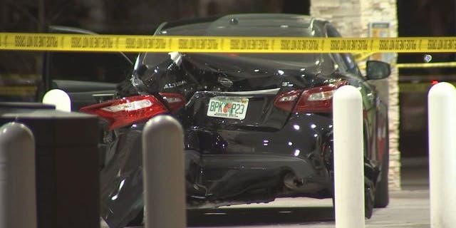 A black Nissan sedan is seen at a gas station in Largo, Fla., after a driver's confrontation with a police officer, March 23, 2018.