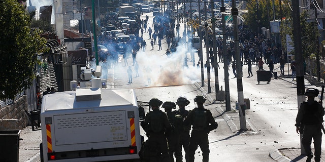 Palestinians clash with Israeli troops during a protest against the U.S. decision to recognize Jerusalem as Israel's capital.