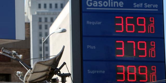 Wholesale gas prices rose in October for the fourth straight month. Shown here are high gasoline prices at a Chevron gas station in Los Angeles.