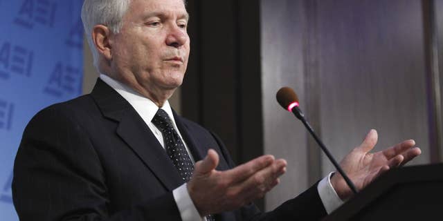 Defense Secretary Robert Gates gestures while speaking at the American Enterprise Institute for Public Policy Research in Washington, Tuesday, May 24, 2011. (AP Photo/Alex Brandon)