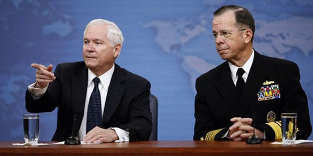 Mar. 25: Defense Secretary Robert Gates and Chairman of the Joint Chiefs of Staff Adm. Mike Mullen take questions on 'Don't Ask, Don't Tell' at a media briefing in Washington.