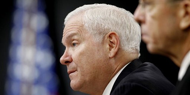 Defense Secretary Robert Gates, left, and Joint Chiefs Chairman Adm. Mike Mullen talk to the media about defense budget cuts Jan. 6 at the Pentagon.