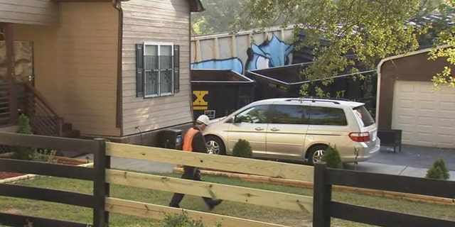 An Atlanta resident was injured when a freight train derailed and struck his home.