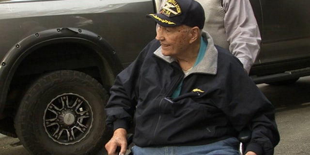 Retired naval aviator Frank Coleman was honored to have assistance from the scouts retiring his flags.