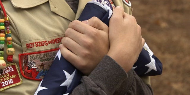 Retired naval aviator Frank Coleman was honored to have assistance from the scouts retiring his flags.
