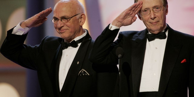 Actors Gavin MacLeod (L) and Bernie Kopell, stars of the television series "Love Boat" salute producer Aaron Spelling during a tribute to his long career at the 3rd annual TV Land Awards in Santa Monica, California March 13, 2005. The awards show honored classic television shows and performers. The 3rd annual TV Land Awards will be telecast in the United States on the TV Land cable channel March 16. REUTERS/Fred Prouser FSP - RTR507V